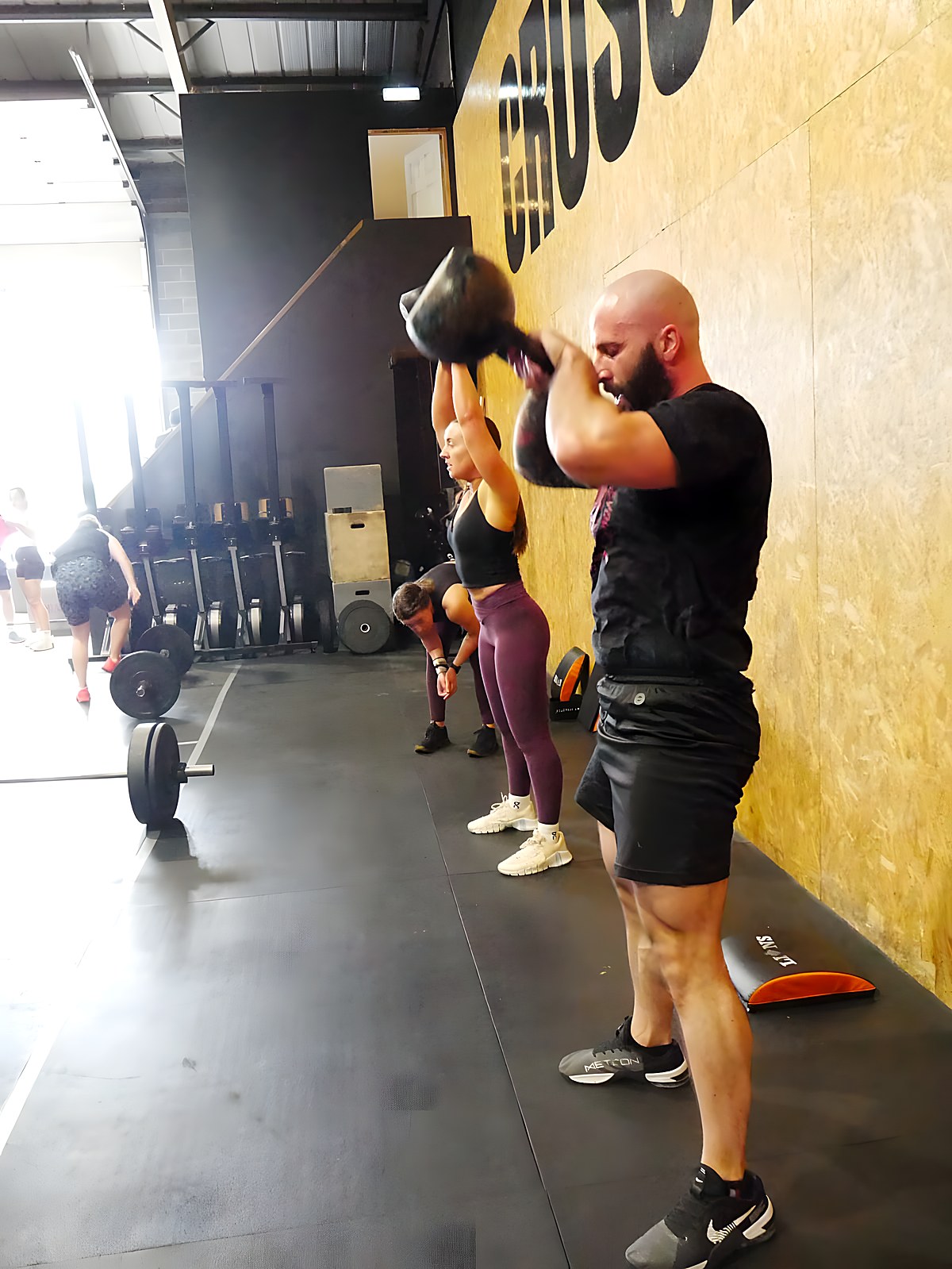 Adam coaching a kettlebell conditioning session