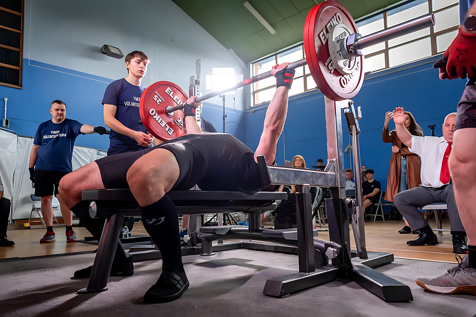 Adam Gucwa benching in a powerlifting competition
